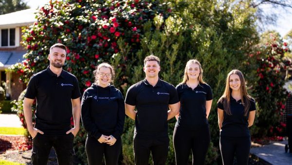 The Healthproof clinical team standing together outside