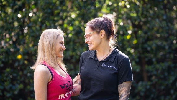 Two Healthproof physiotherapists talking outdoors
