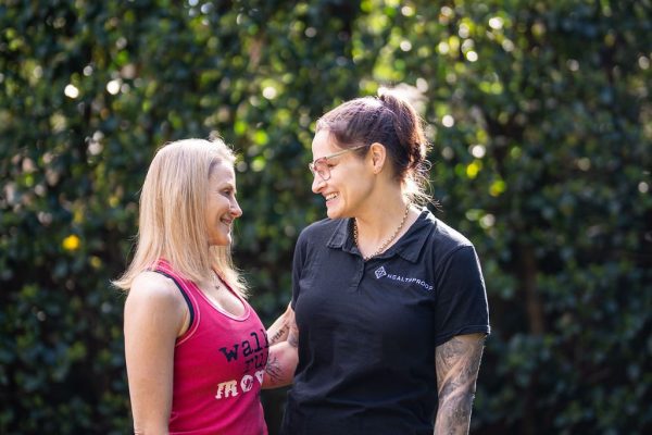 Two Healthproof physiotherapists talking outdoors